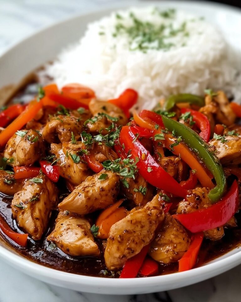 Sizzling Garlic Chicken Stir-Fry with Colorful Peppers and Steamed Rice Recipe