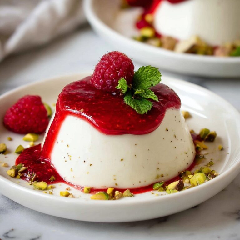 Creamy Vanilla Panna Cotta with Raspberry Coulis and Toppings Recipe